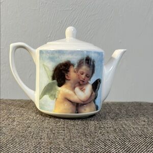 Kissing angels ceramic teapot or creamer.